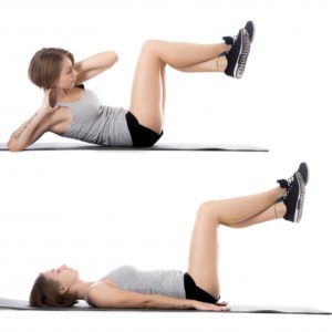 woman-lying-on-the-floor-while-doing-sit-ups_1163-885